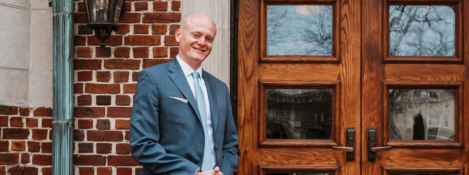 Two people shaking hands in an office setting, symbolizing agreement or partnership
